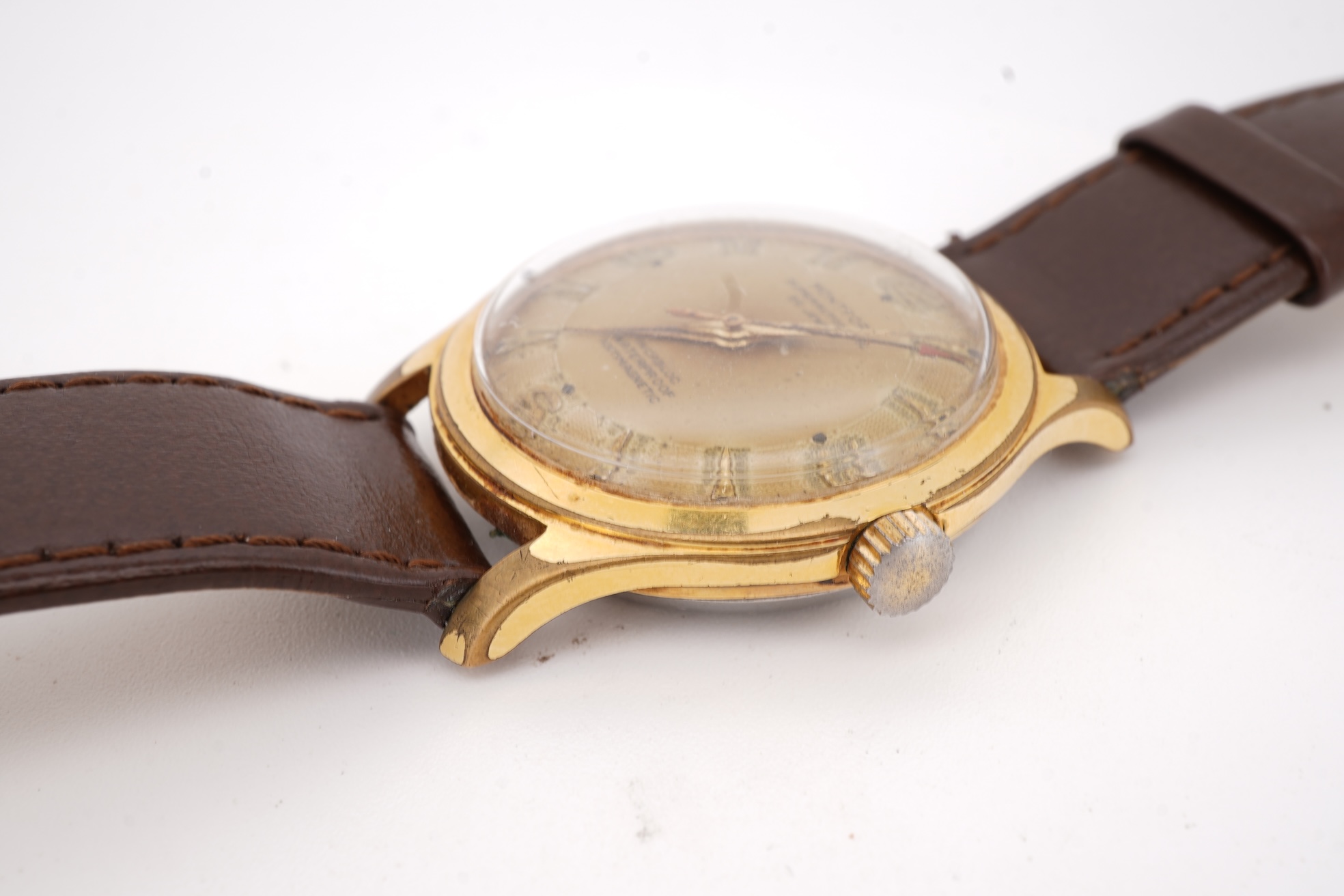 A gentleman's steel and gold plated Montfort Superautomatic wrist watch, with Roman and quarterly Arabic numerals, case diameter 34mm, on a later associated leather strap.